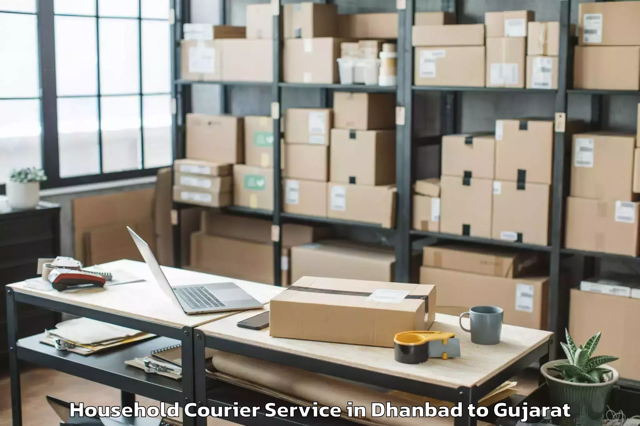 Reliable Dhanbad to Kheda Household Courier